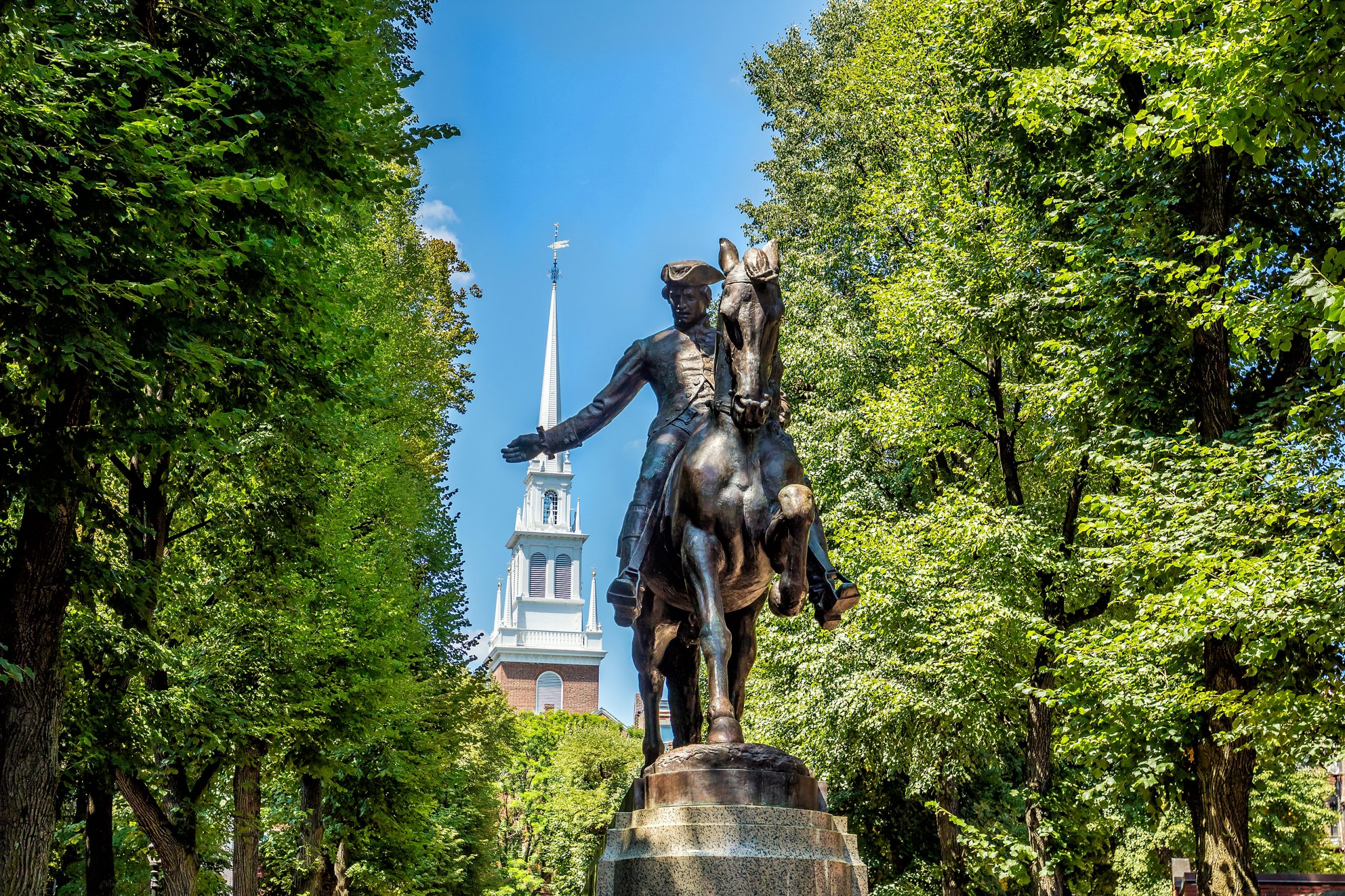 Paul Revere Statue and Old North Church in Boston, Massachusetts with blue sky